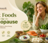 Healthy menopause-friendly foods including salmon, avocado, berries, leafy greens, yogurt, nuts, and seeds with a smiling middle-aged woman for Diet2Nourish menopause nutrition blog banner